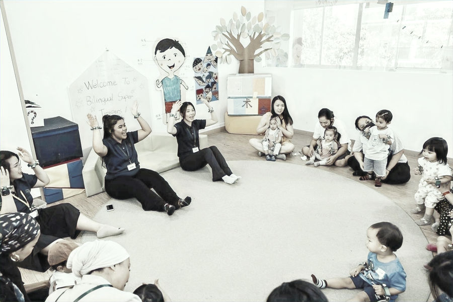 Children exploring and playing together at a Little Forest playgroup class in Singapore