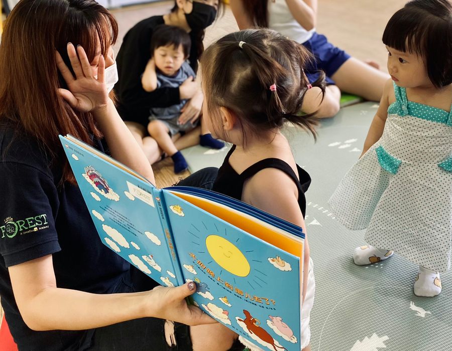 Teacher reading to children